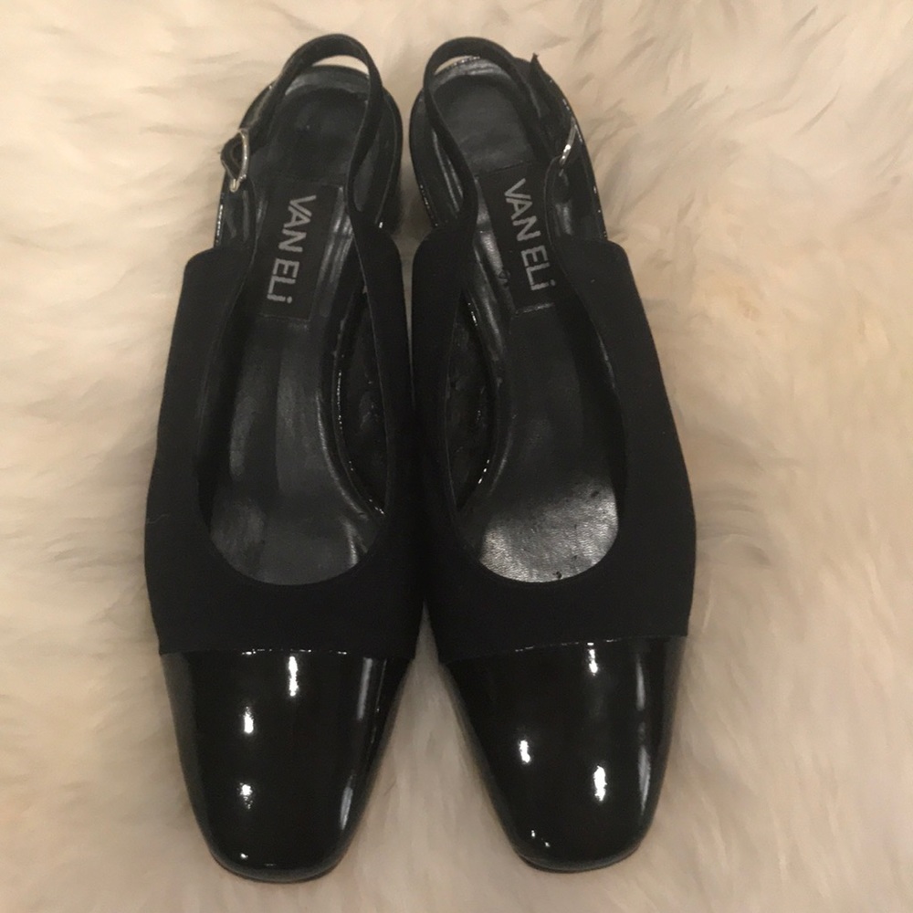 Van Eli navy cap toe sling backs.